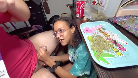 Ebony brunette gives a blow job and smokes with her man