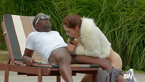 Hairy brunette and interracial milf in the surf house