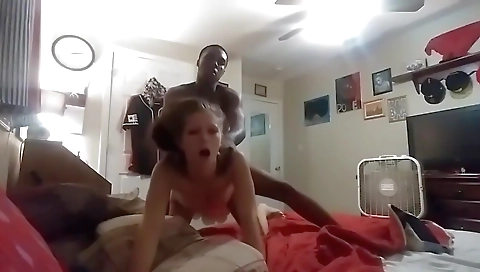 Amateur interracial video showing a brunette getting cunnilingus