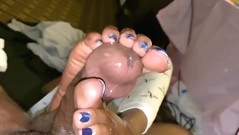 Footjob from a hot babe to a big cock in the porn clip