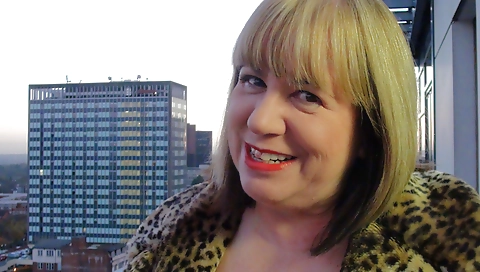 A mature blonde is getting fucked by two mature men