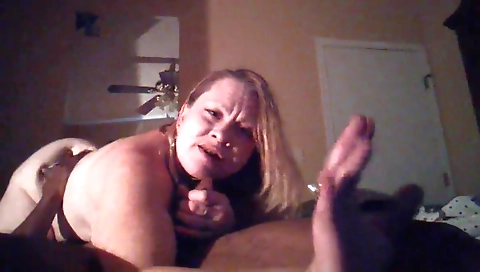Busty bimbo fucks a black cock in her mouth in amateur video