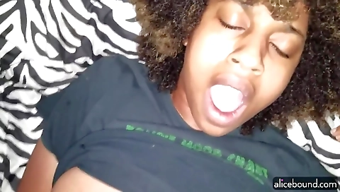 Black guy rides the dildo on the hairy pussy of a black girl